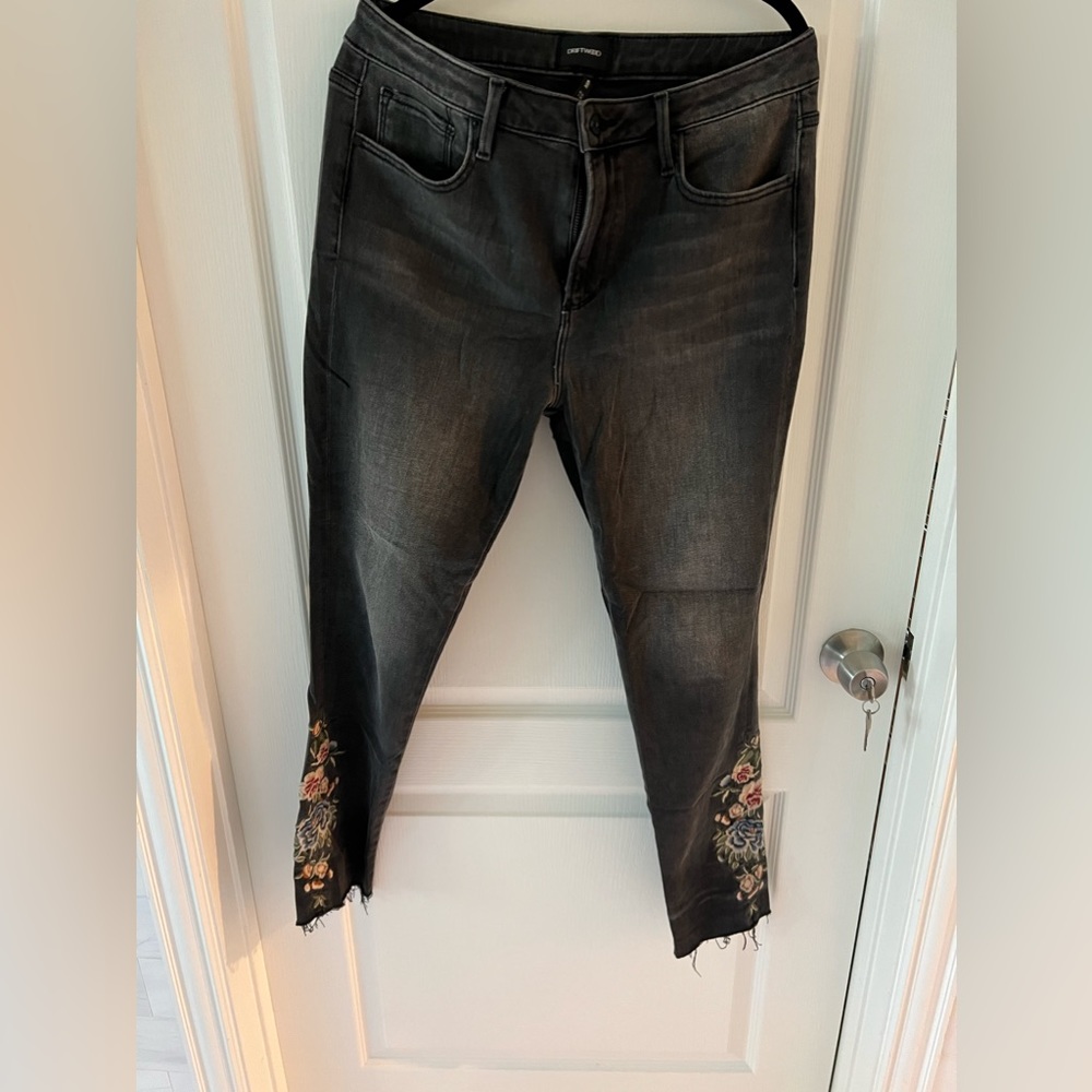 Super cute Sundance black jeans with embroidered leg and fringe cuff.